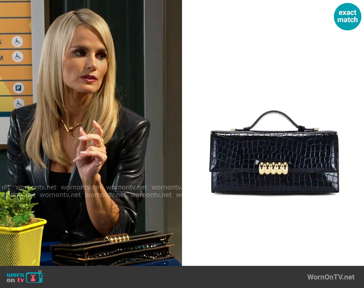Retrofete Phoebe Clutch worn by Vanessa McBride (Lauren Buglioli) on Beyond the Gates