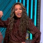 Sunny’s brown satin tie neck top on The View