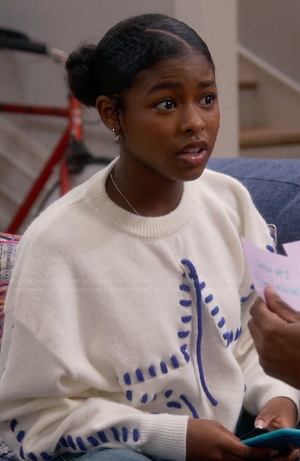 Sydney's white star whipstitch sweater on The Upshaws