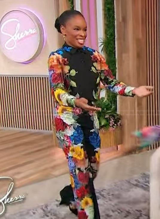 Amber Ruffin’s black floral print blouse and pants on Sherri
