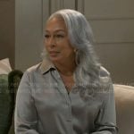 Anita’s grey satin shirt and floral pants on Beyond the Gates