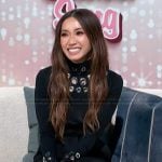 Brenda’s black grommet embellished sweater on Access Hollywood