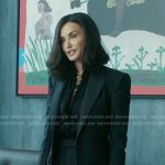 Cami’s black ruffle blouse and blazer on Landman