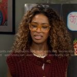 Courtney's burgundy sweater vest with gold buttons on The Neighborhood