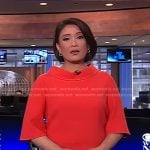 Elaine Quijano’s red roll-neck short sleeve top on CBS Evening News
