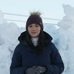 Emilie’s navy down coat and purple knit beanie on Today