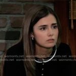 Emma’s black top with gold buttons and white stripe trim on General Hospital