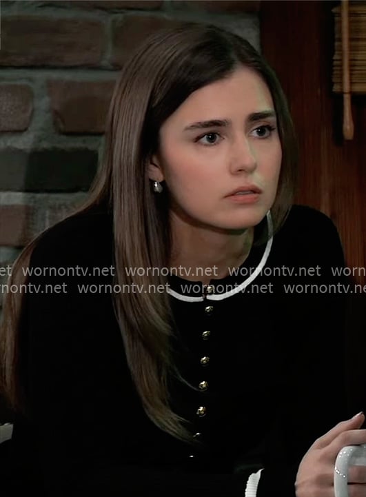Emma’s black top with gold buttons and white stripe trim on General Hospital