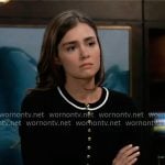 Emma’s black top with gold buttons and white stripe trim on General Hospital