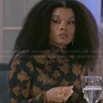 Eva’s black floral print top on Beyond the Gates