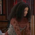 Eva’s red lace mini dress with blue corset on Beyond the Gates