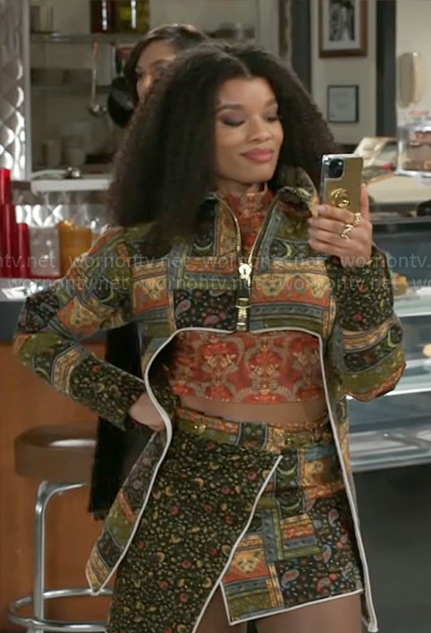 Eva’s patchwork print jacket and skirt set on Beyond the Gates
