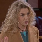 Jan’s tan jacket and turquoise necklace on Beyond the Gates