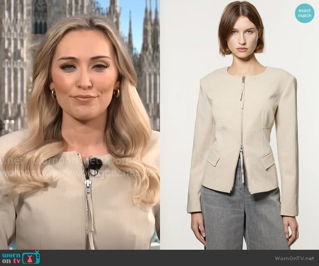 Kelly O’Grady’s beige zip up jacket on CBS Mornings