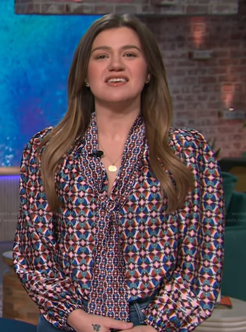 Kelly’s geometric print tie neck blouse on The Kelly Clarkson Show