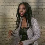 Lynette’s leather jumpsuit and snake coat on Beyond the Gates