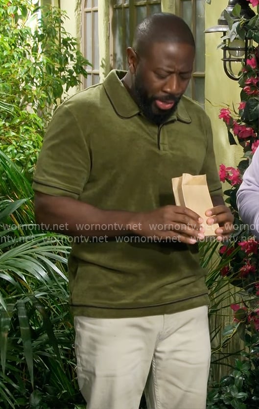 Malcolm’s green terry polo on The Neighborhood