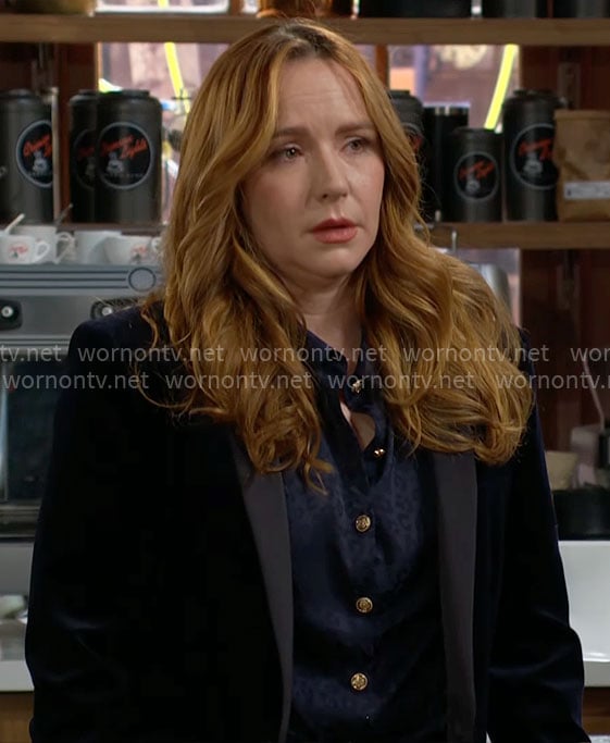 Mariah’s navy blouse with gold buttons on The Young and the Restless