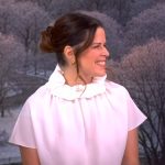 Neve Campbell’s white ruffle neck top on The View