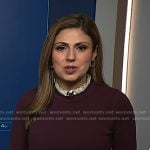 Rana Novini’s burgundy ruffle neck short sleeve sweater on NBC News Daily