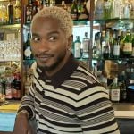 Scott’s brown striped cardigan on Access Hollywood