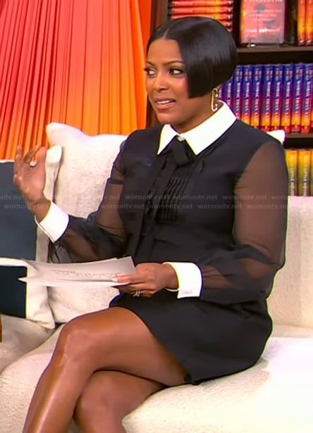 Tamron’s black sheer sleeve dress on Tamron Hall Show