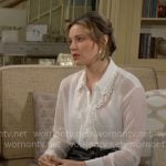 Tessa’s white ruffle blouse on The Young and the Restless