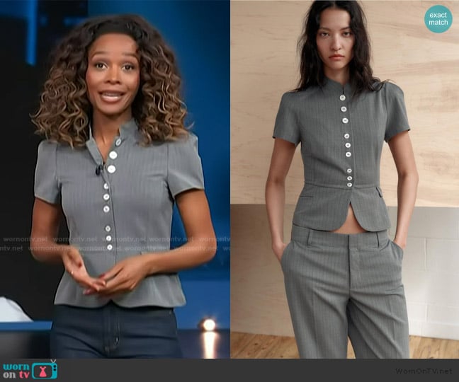 Zuri’s gray peplum top on Access Hollywood