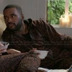 Andre’s leopard print onesie on Beyond the Gates