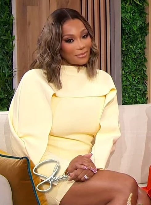 Angela Oakley’s yellow mini cape dress on Sherri