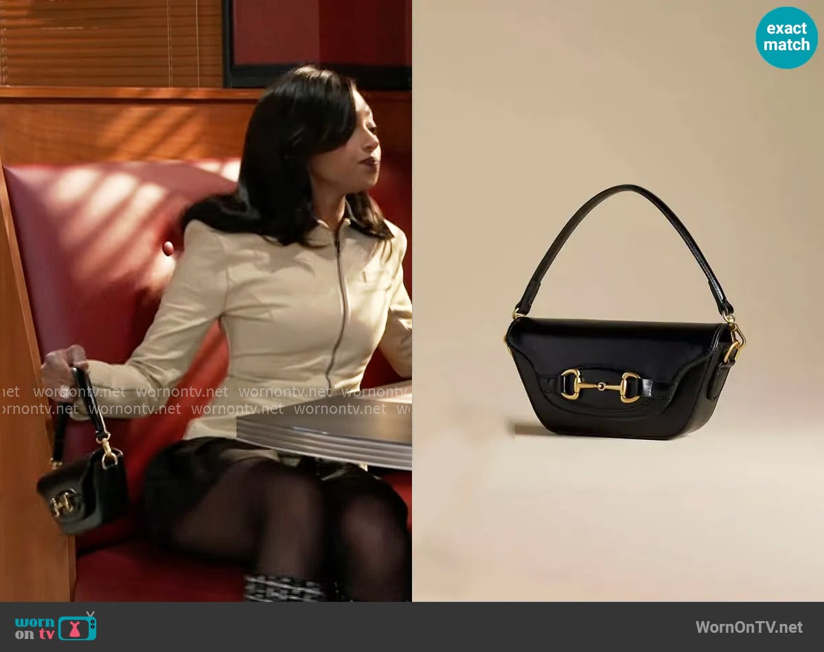 Anthropologie The Delilah Bag Horsebit Edition worn by Kat Richardson (Colby Muhammad) on Beyond the Gates