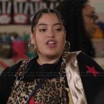 Ashley's star graphic sweater and overalls on Abbott Elementary