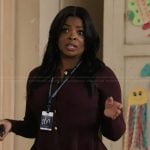 Ava's burgundy peplum cardigan on Abbott Elementary