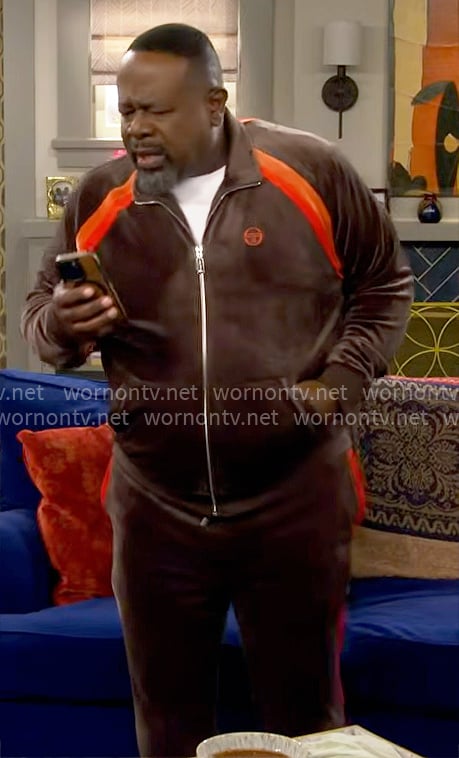 Calvin’s brown and orange velour track suit on The Neighborhood