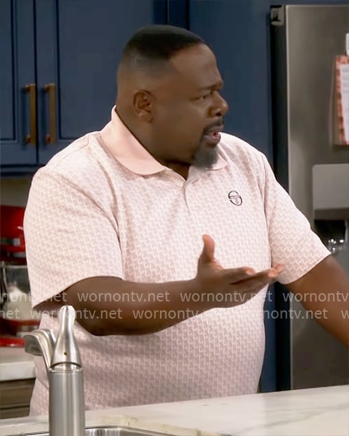 Calvin’s pink printed polo shirt on The Neighborhood