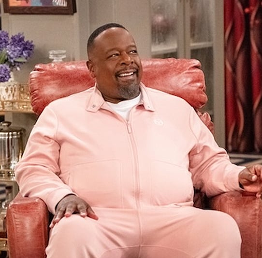 Calvin's pink track jacket and pants set on The Neighborhood