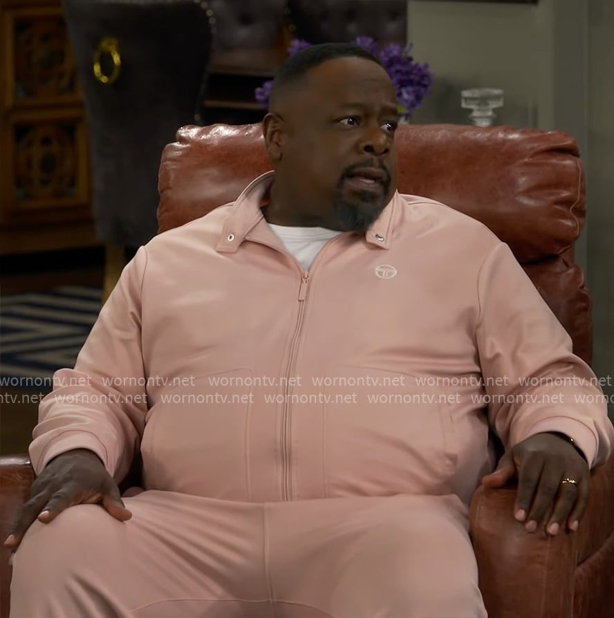 Calvin's pink track jacket and pants set on The Neighborhood