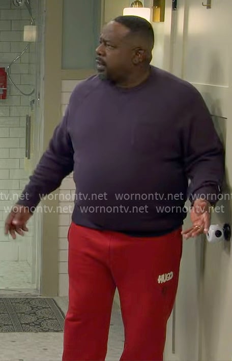 Calvin's red HUGO sweatpants on The Neighborhood