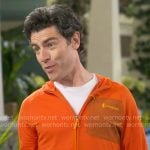 Dave's orange zip jacket on The Neighborhood