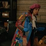 Elsbeth’s cityscape print coat on Elsbeth