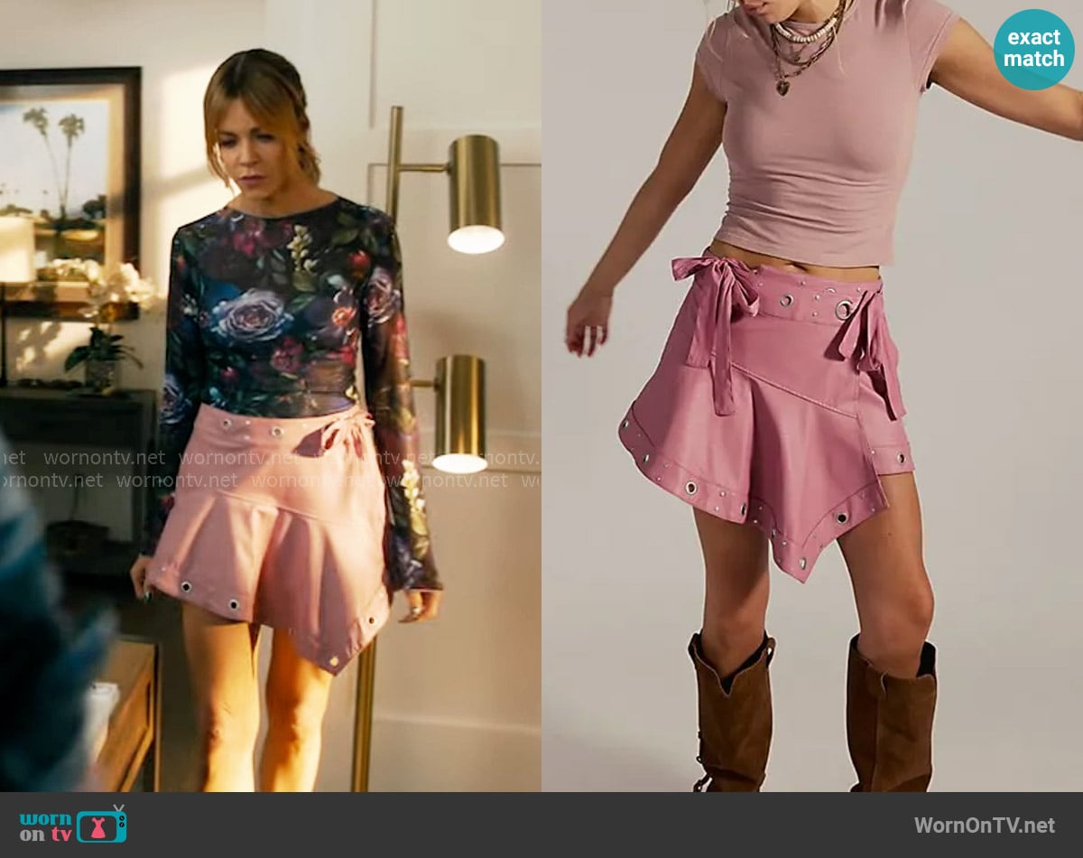 Free People Cassis Vegan Leather Wrap Skirt in Mauve Blossom worn by Morgan Gillory (Kaitlin Olson) on High Potential