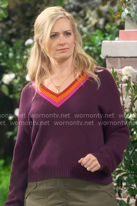 Gemma’s plum purple sweater with striped trim on The Neighborhood