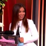 Gretta’s white peplum jacket and floral print dress on The View