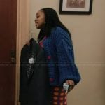 Janine’s printed dress and chunky blue cardigan on Abbott Elementary