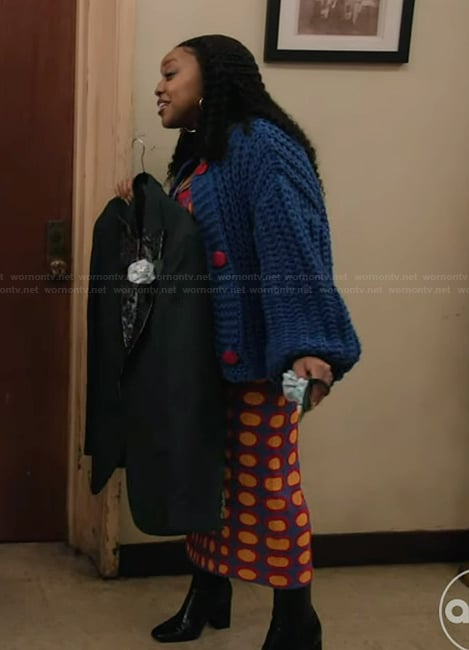 Janine's printed dress and chunky blue cardigan on Abbott Elementary