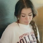 Jen’s white printed sweater on The Secret Lives of Mormon Wives