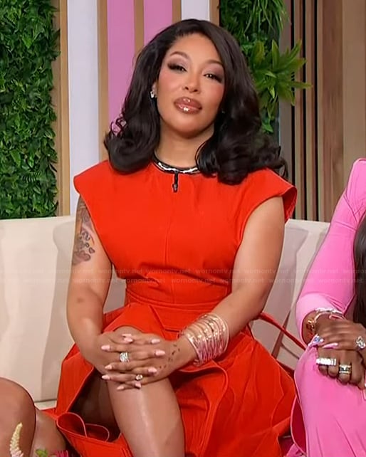 Kimberly’s red crop top and pants on Sherri