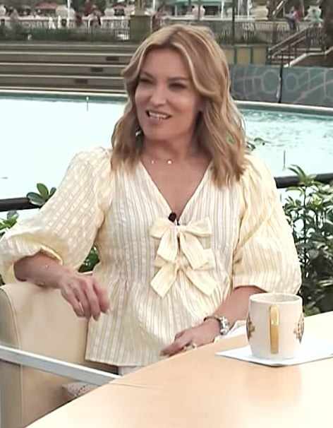 Kit's yellow stripe bow detail top on Access Hollywood