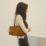 Layla’s brown leather bag on The Secret Lives of Mormon Wives
