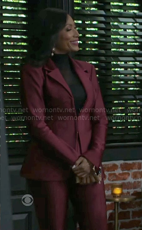 Leslie’s burgundy corset suit on Beyond the Gates